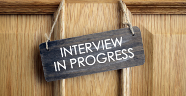 Interview in progress sign on office door